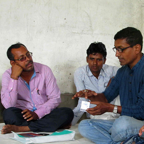 Field team discussion during a community programme